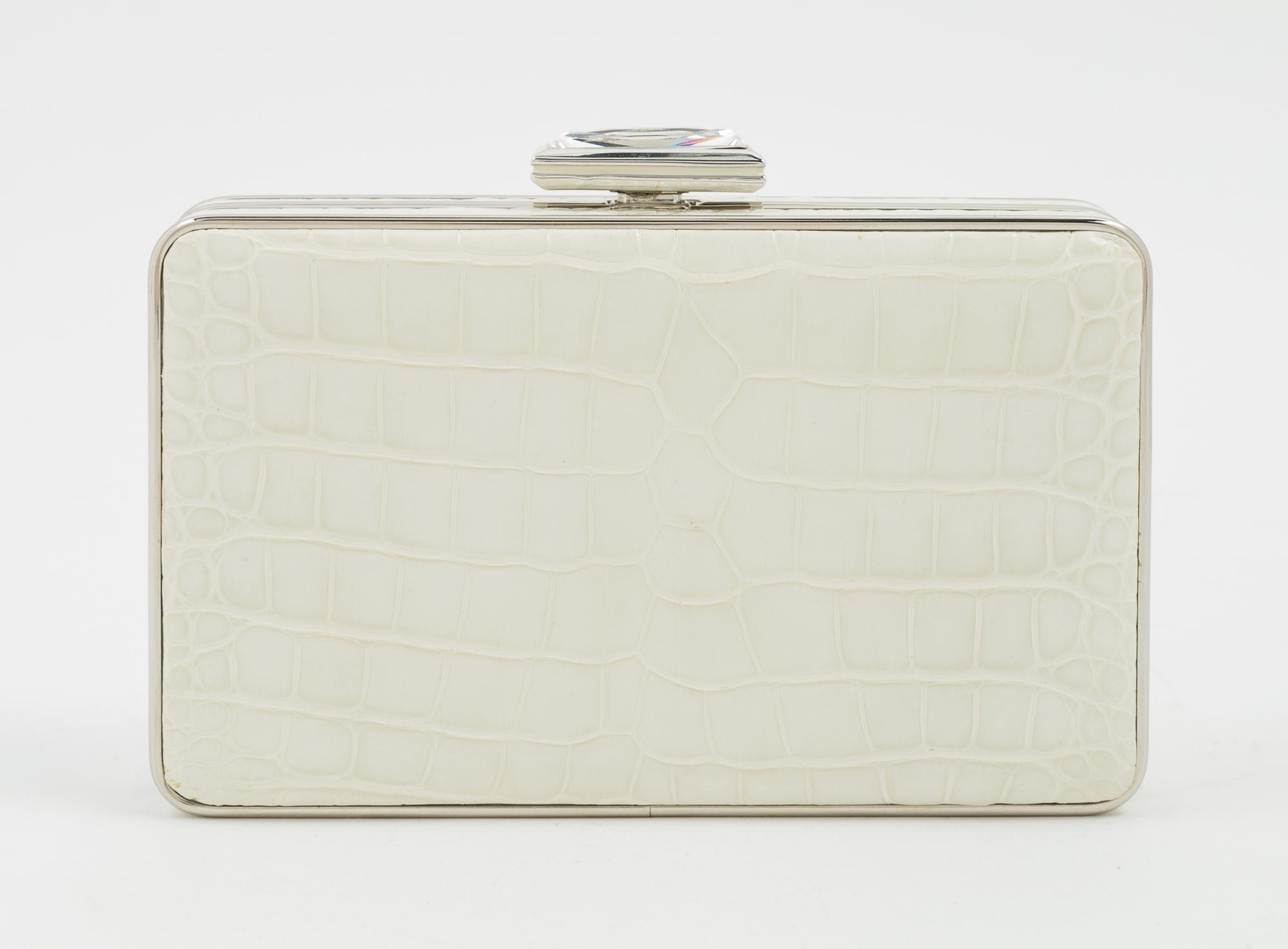 A Judith Leiber Cream Crocodile Clutch, 6" x 3.5" x 1.5".