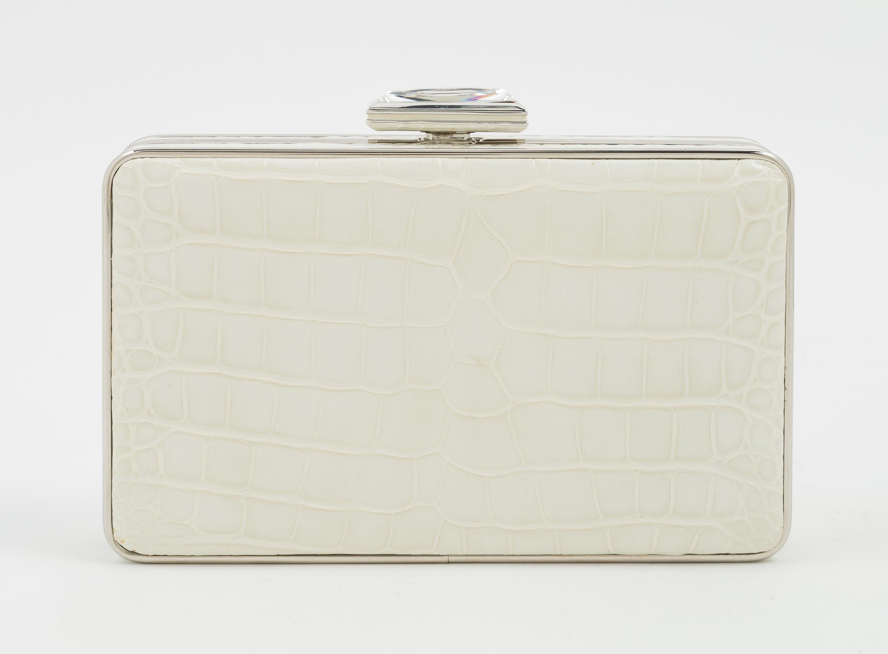 A Judith Leiber Cream Crocodile Clutch, 6" x 3.5" x 1.5".