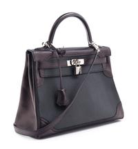 An Hermes Bicolor Noir and Bleu Indigo Swift and Taurillon Clemence 32cm Kelly Ghillies Handbag, 13" x 9.5" x 4.5".