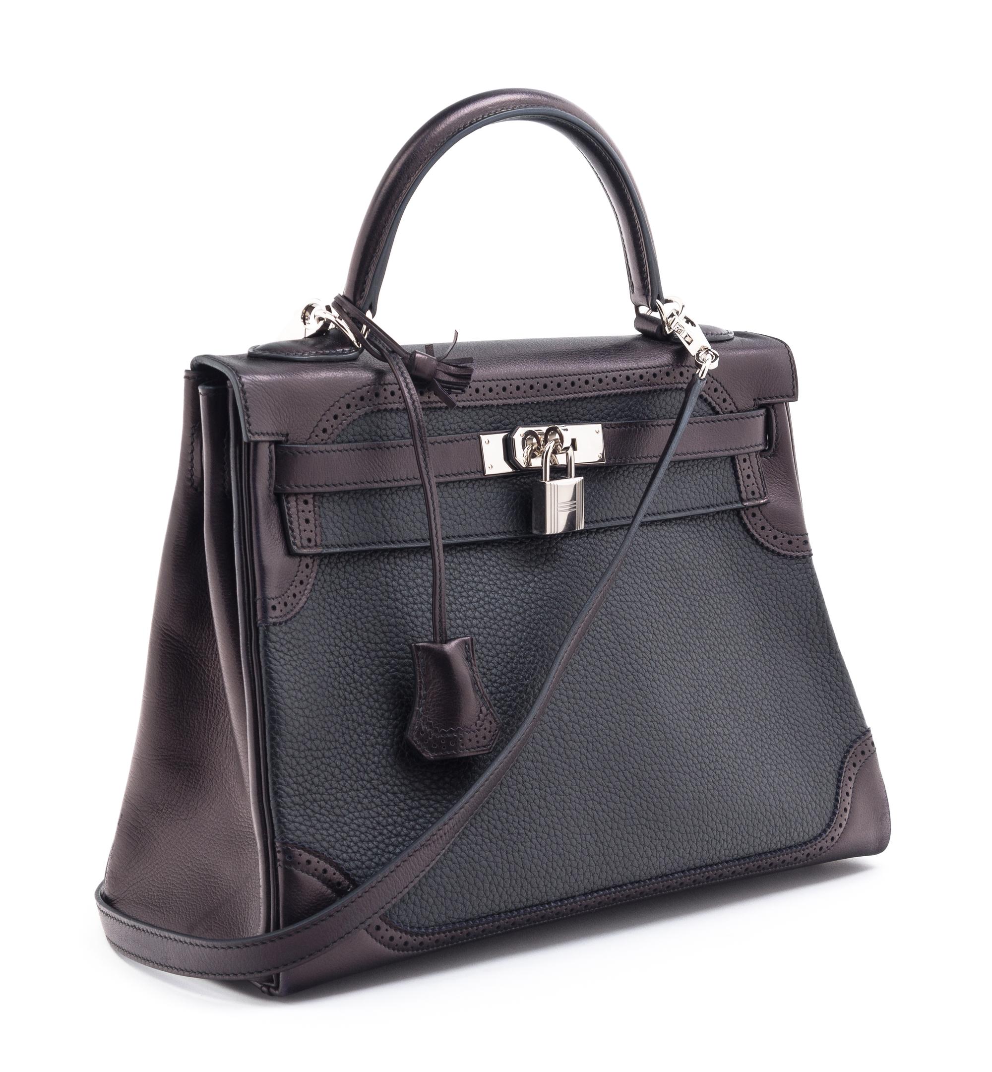 An Hermes Bicolor Noir and Bleu Indigo Swift and Taurillon Clemence 32cm Kelly Ghillies Handbag, 13" x 9.5" x 4.5".