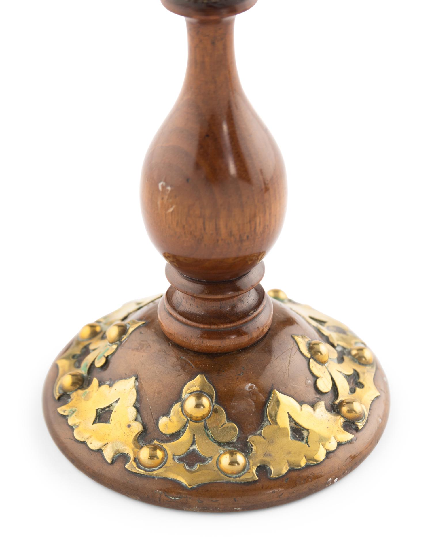 A Pair of Victorian Brass and Walnut Candlesticks