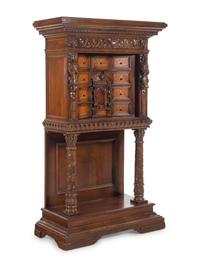 A Renaissance Revival Carved Walnut and Marquetry Collector's Cabinet