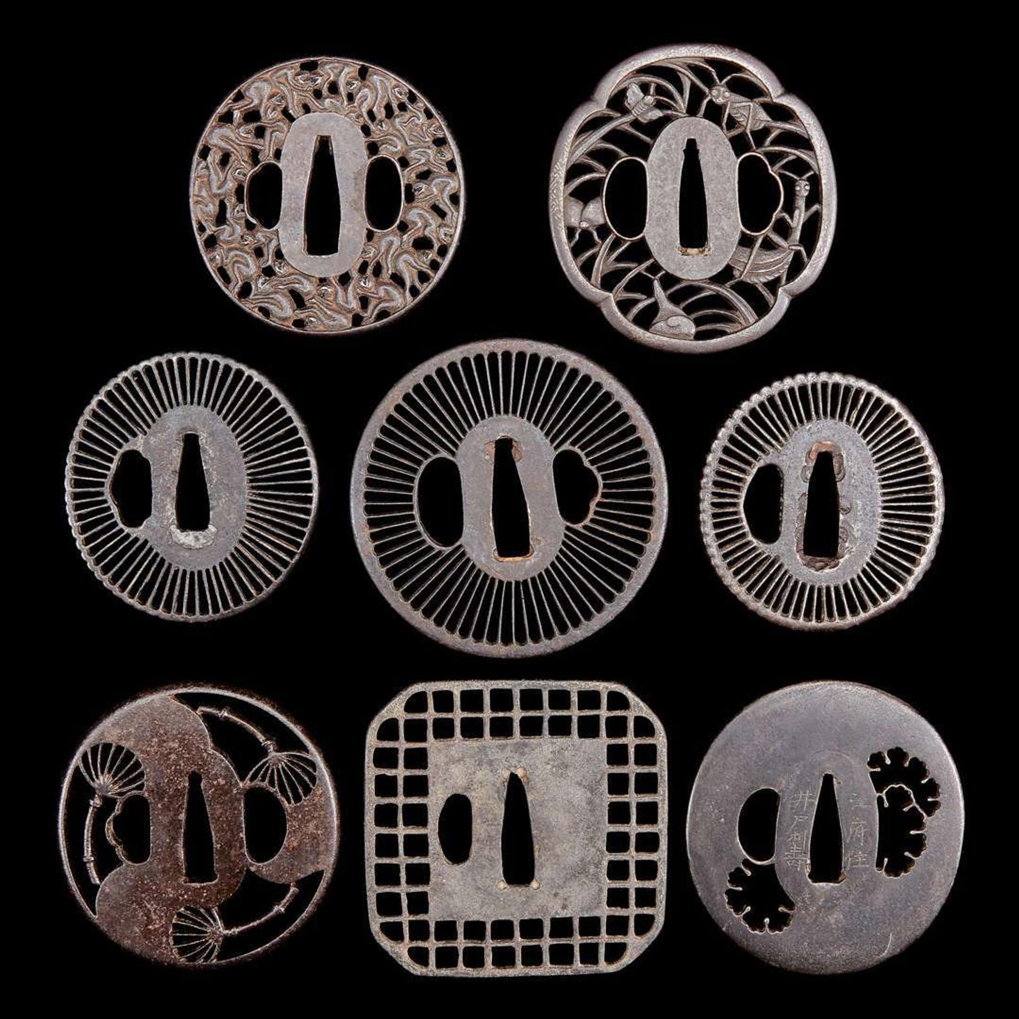 A group of eight Japanese pierced iron and metal tsuba 刀镡一组八件 Edo period ??