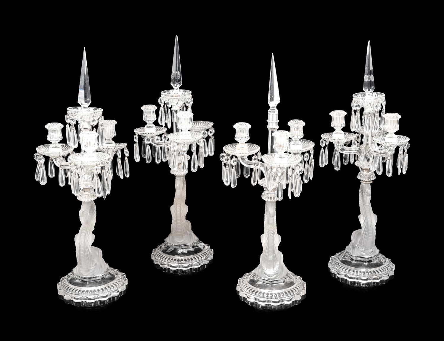 A Set of Four Baccarat Dauphin Three-Light Candelabra