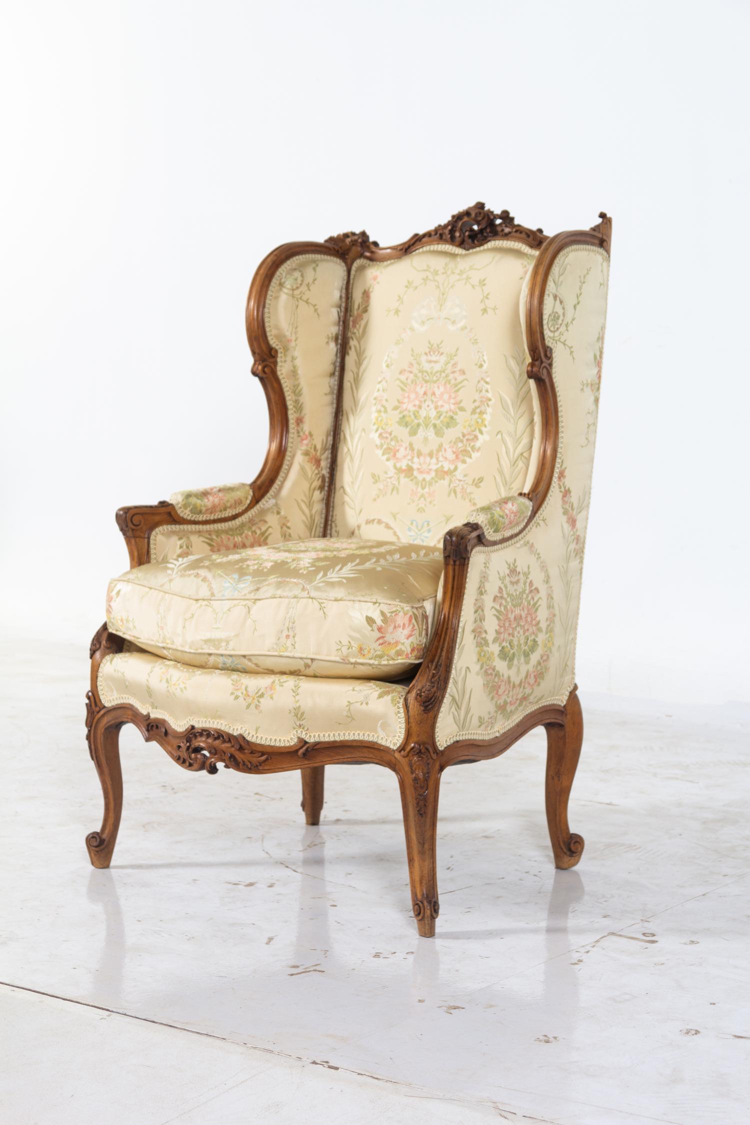 A Louis XV Style Carved Walnut Bergere
