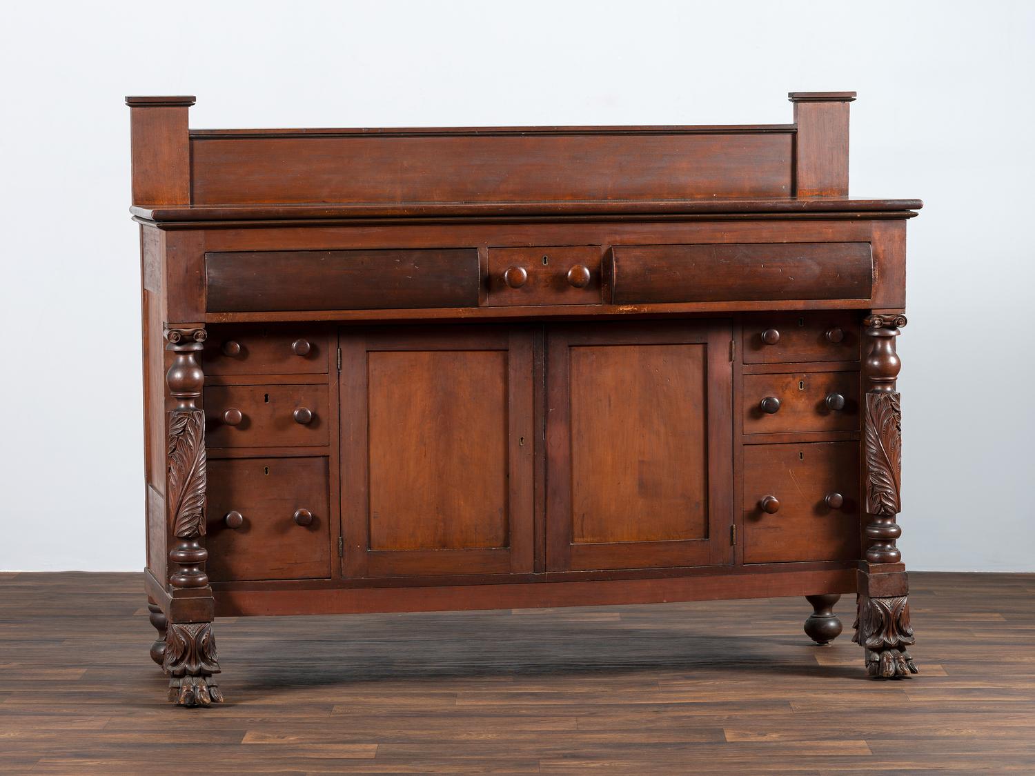 AWAITING DONATION - A Classical Carved and Stained Cherrywood Sideboard