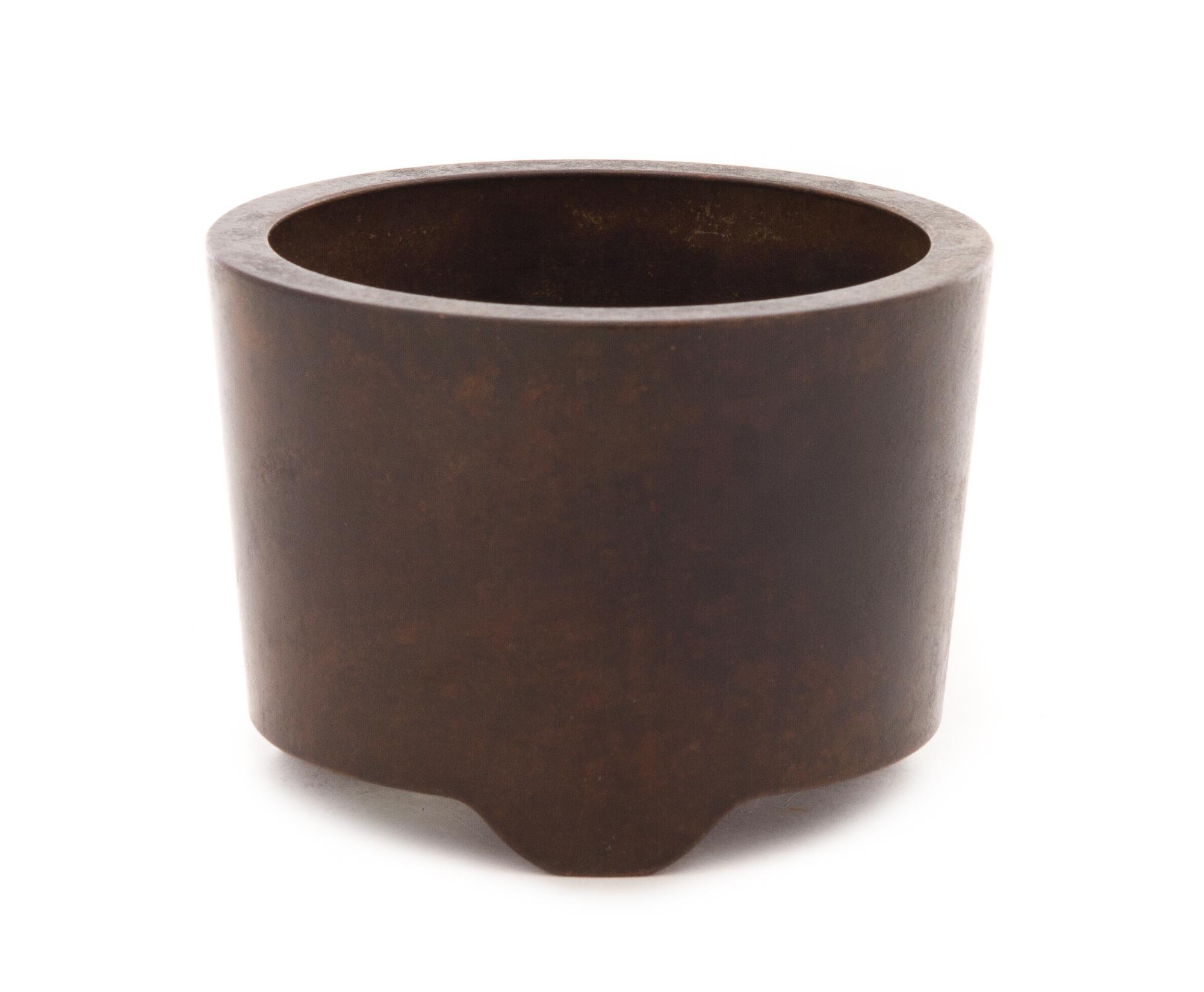 A Bronze Tripod Censer Height 3 1/8 x diameter 4 1/4 inches.