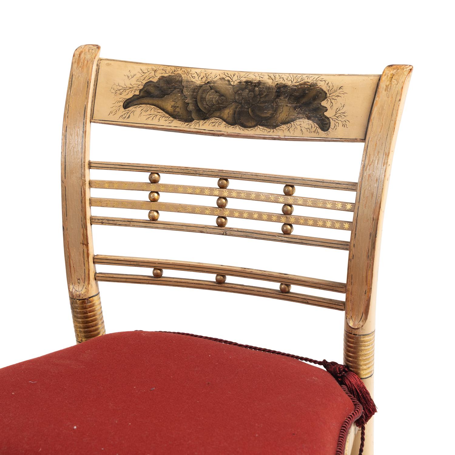 A Set of Four Classical Cream-Painted and Parcel Gilt "Hitchcock" Dining Chairs