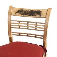 A Set of Four Classical Cream-Painted and Parcel Gilt "Hitchcock" Dining Chairs