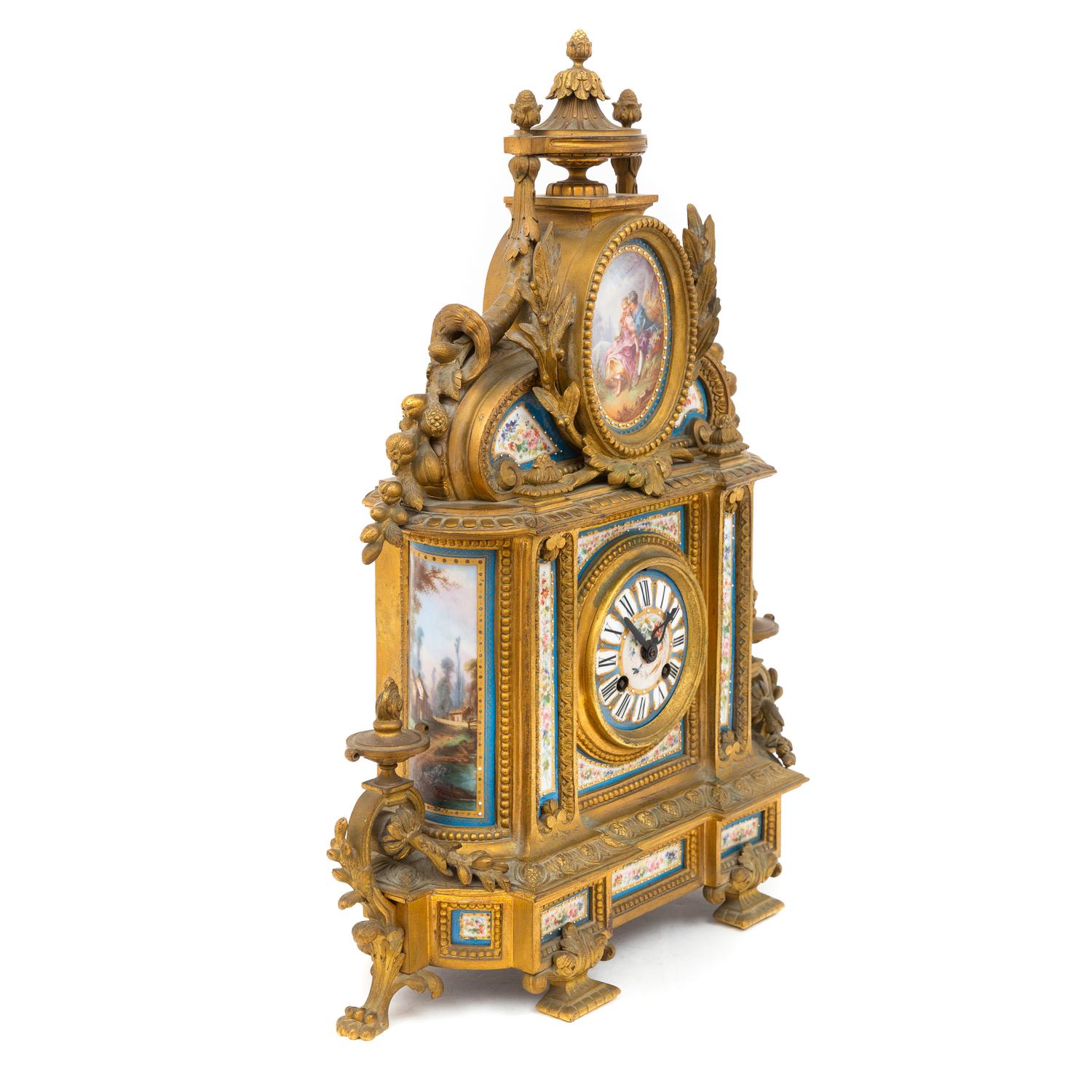 A Louis XVI Style Gilt Bronze and Porcelain-Mounted Mantel Clock