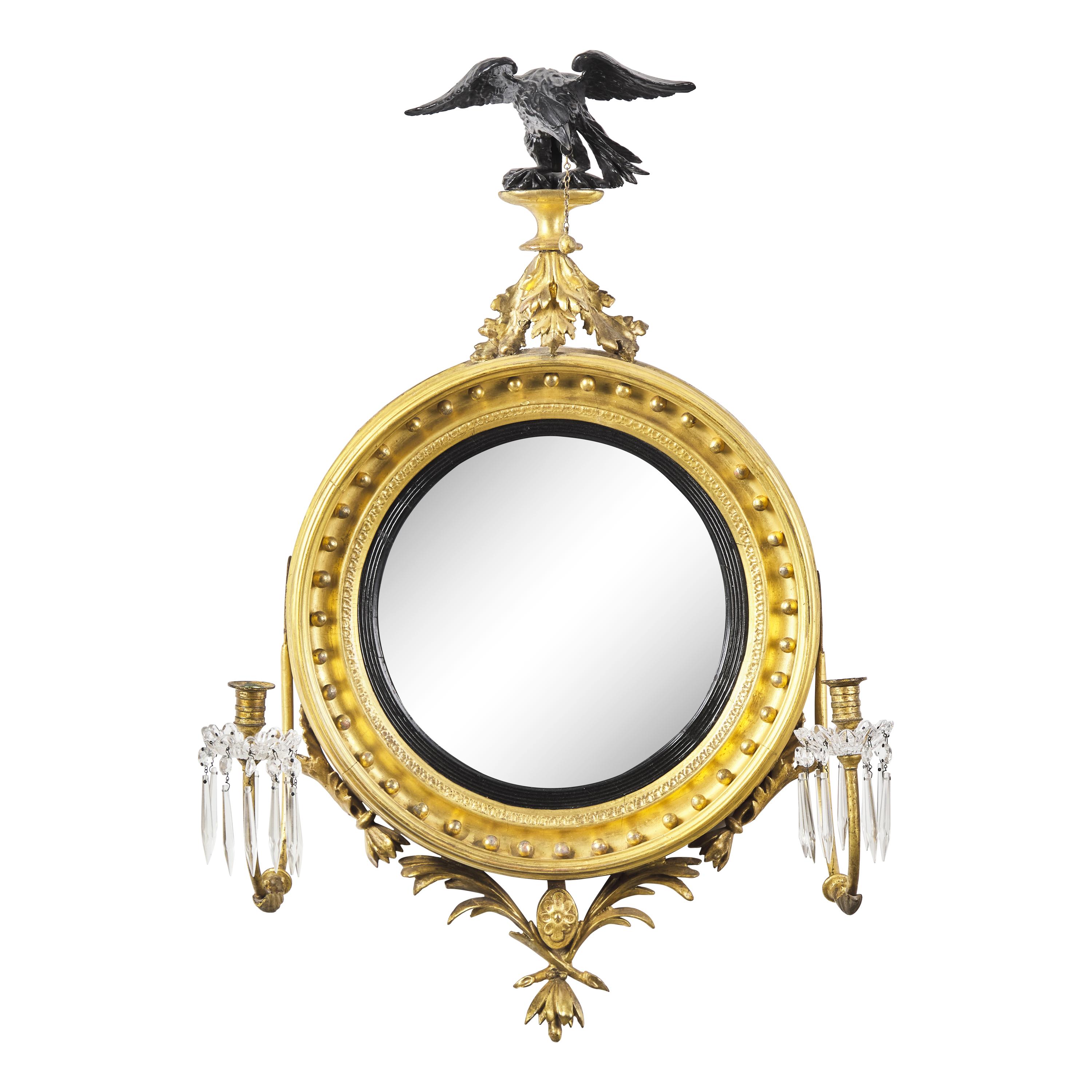 A Classical Carved, Gilt and Parcel Ebonized Two-Light Bull's Eye Girandole Mirror