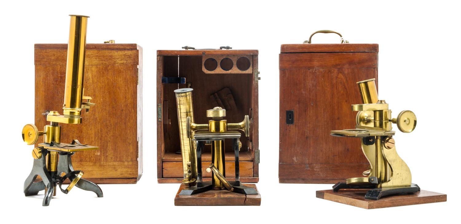 A Group of Three Brass and Black Lacquered Microscopes Height of largest case 10 1/2 inches. — J. F. SLUGG, MANCHESTER, 19TH CENTURY AND OTHERS
