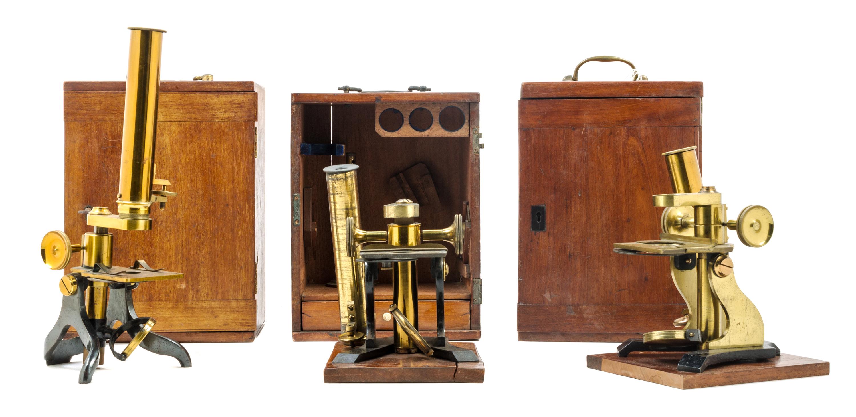 A Group of Three Brass and Black Lacquered Microscopes Height of largest case 10 1/2 inches. — J. F. SLUGG, MANCHESTER, 19TH CENTURY AND OTHERS