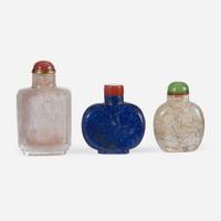 Two Chinese rock crystal snuff bottles and one lapis lazuli snuff bottle
