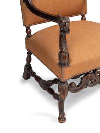 A Pair of William and Mary Style Carved Walnut Armchairs