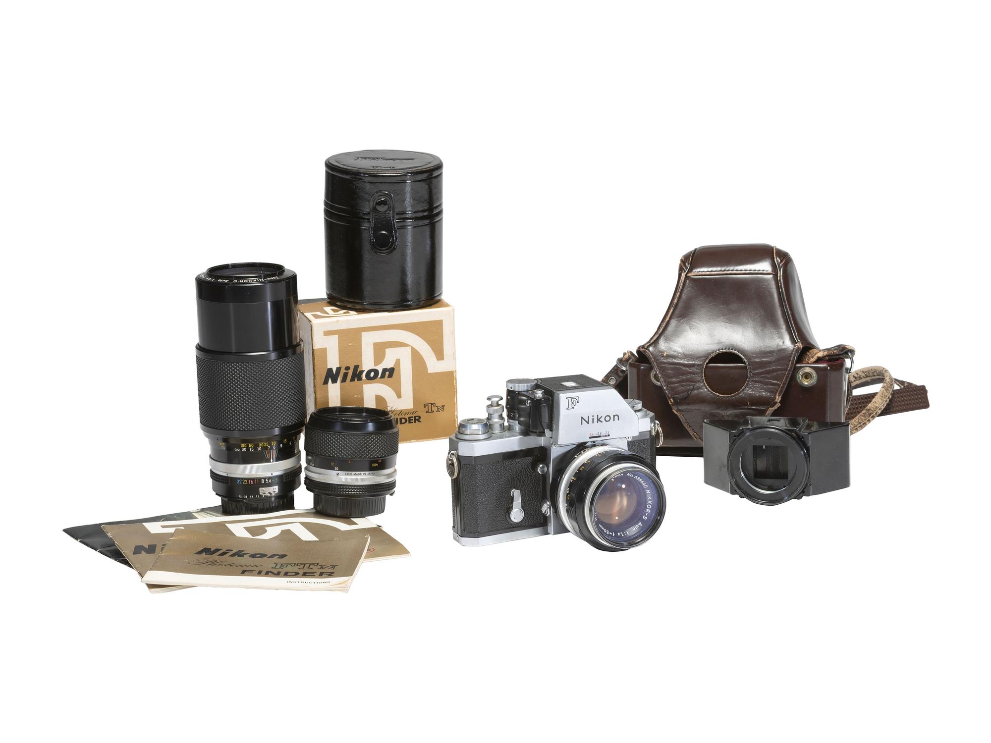 [CAMERAS]. Nikon F 35mm camera outfit with additional lenses and other accessories.