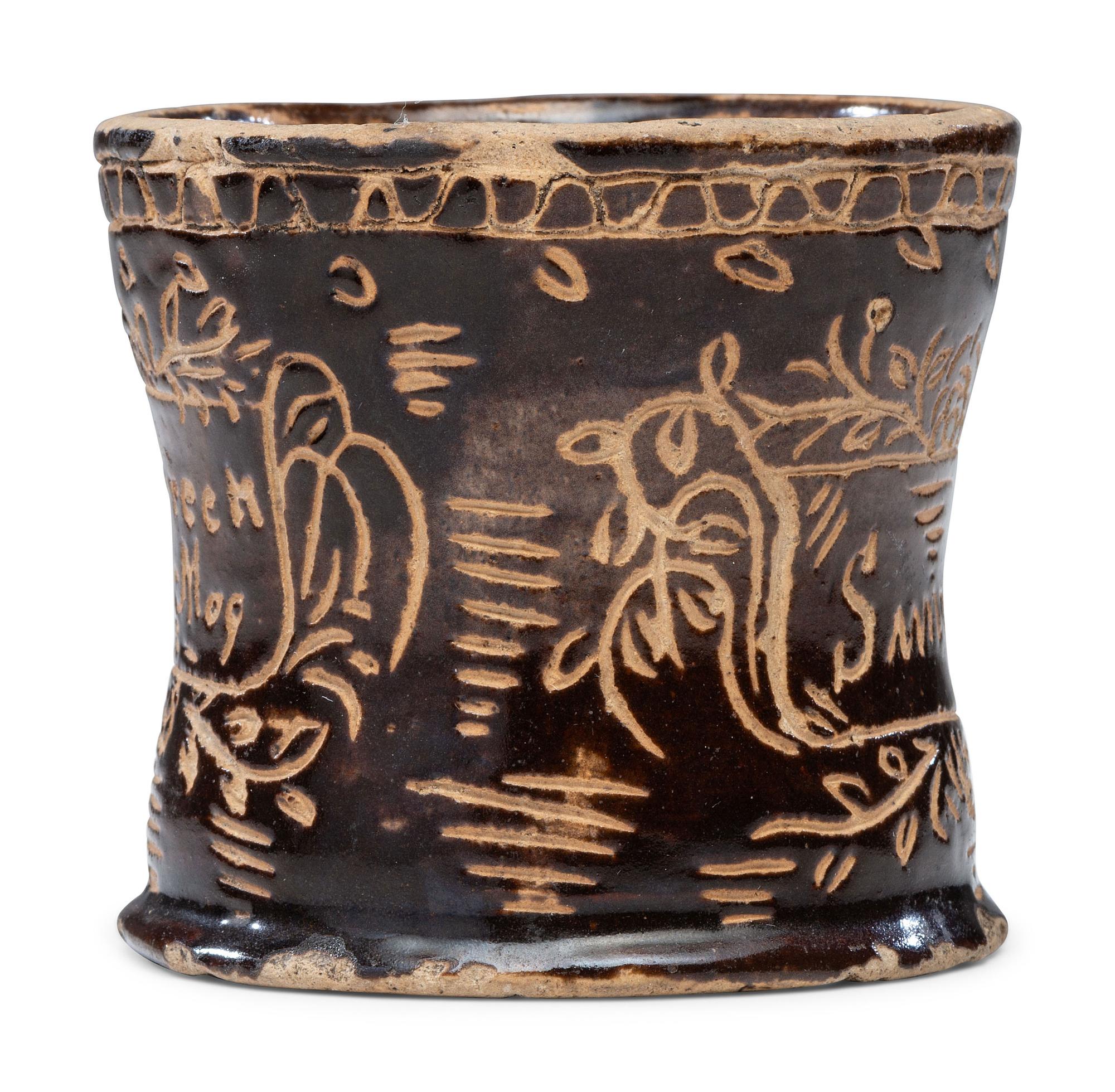 A Slip-Glazed and Incised Mug