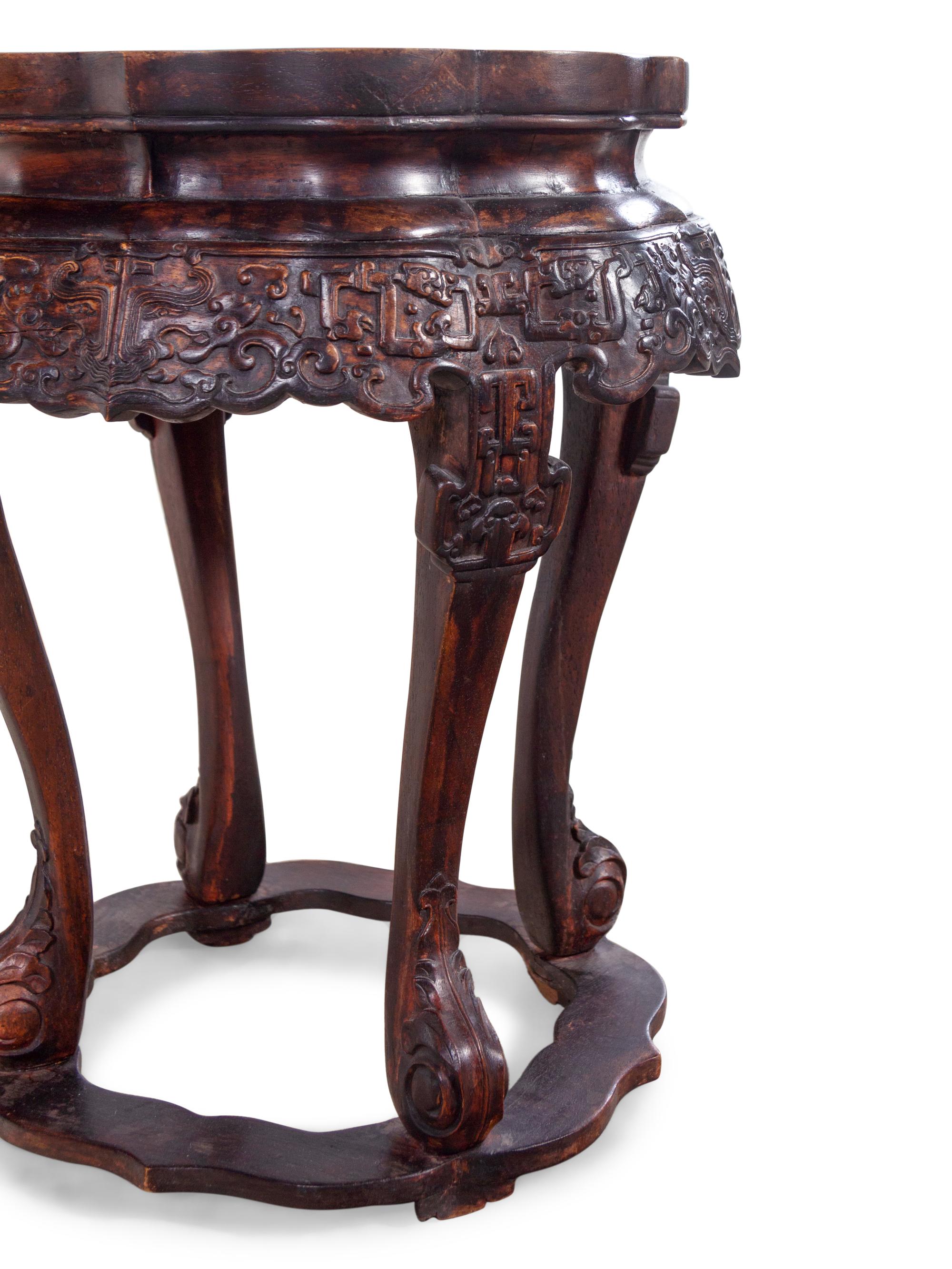 A Pair of Chinese Lacquered Hardwood Flori-Form Stools