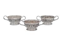 Thirteen American Repousse Silver Bouillon Holders