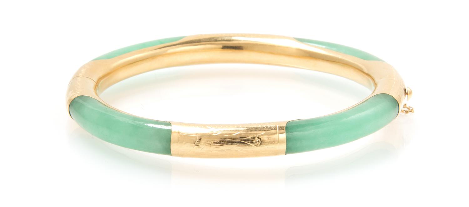 A 14 Karat Yellow Gold and Jade Bangle, 14.30 dwts.