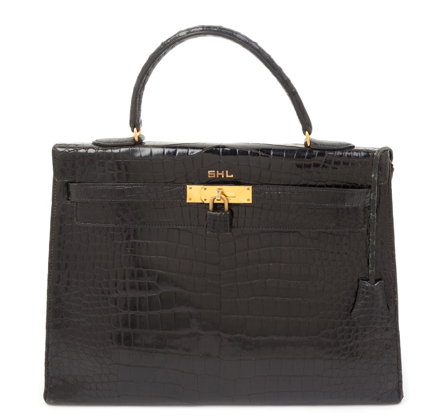 An Hermes 34cm Black Porosus Crocodile Kelly Handbag, 13" x 10" x 5".