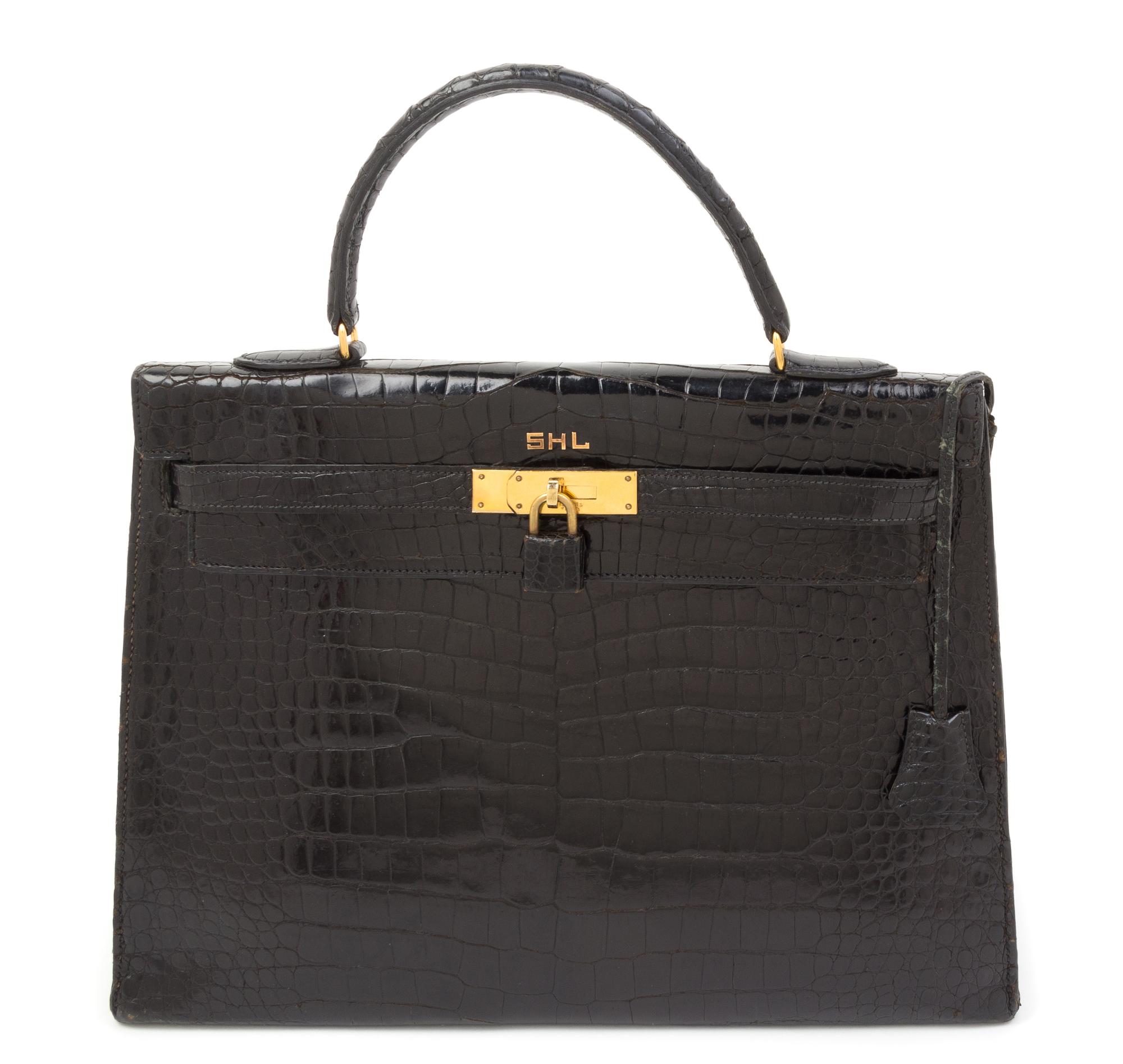 An Hermes 34cm Black Porosus Crocodile Kelly Handbag, 13" x 10" x 5".