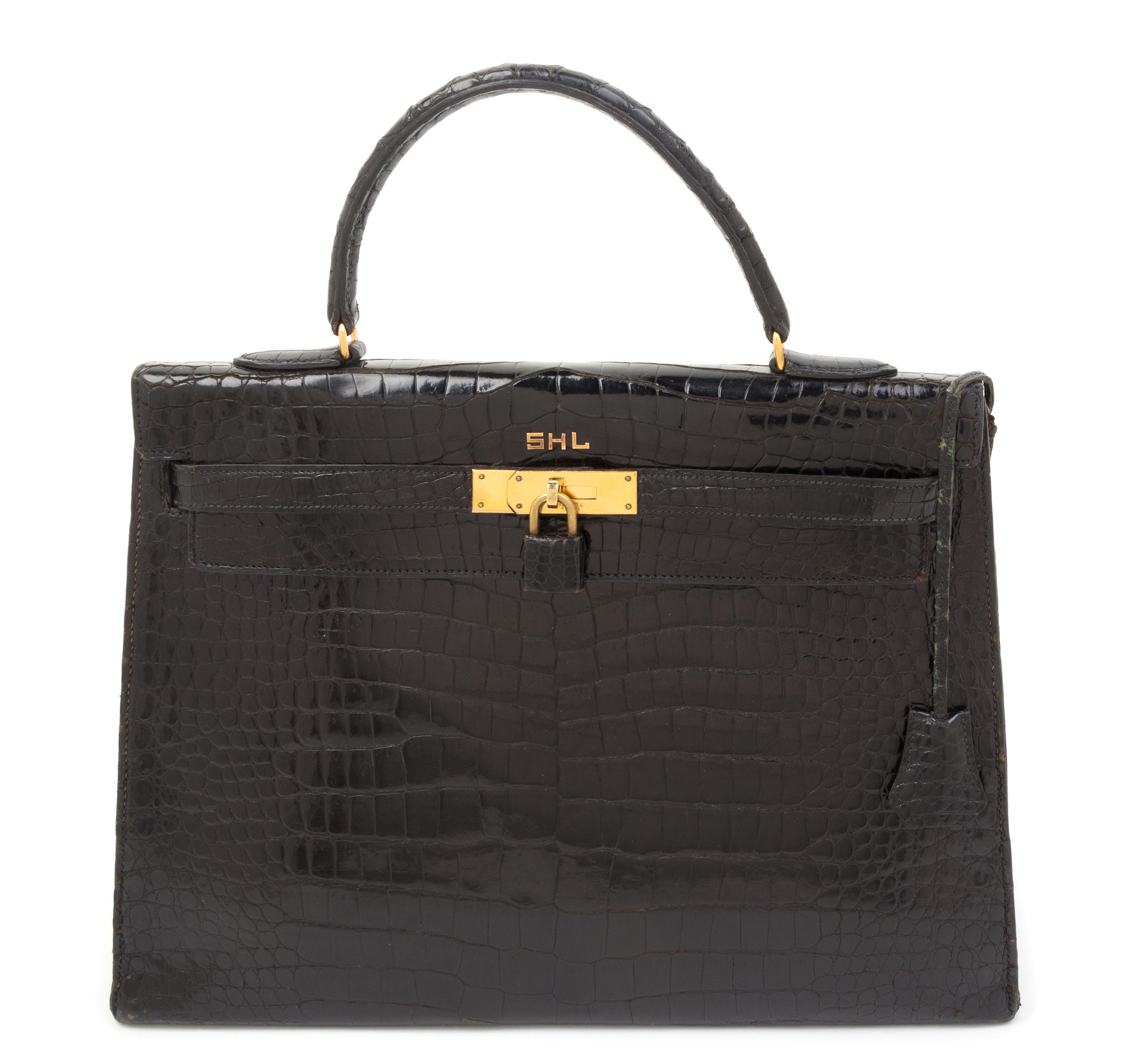An Hermes 34cm Black Porosus Crocodile Kelly Handbag, 13" x 10" x 5".