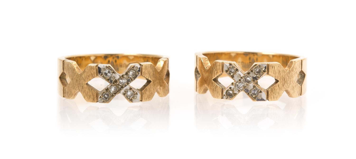 A Pair of 14 Karat Yellow Gold and Diamond "X" Rings, 5.30 dwts.