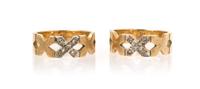 A Pair of 14 Karat Yellow Gold and Diamond "X" Rings, 5.30 dwts.