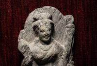A Gandharan Schist Relief of a Musician