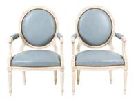 A Pair of Louis XVI Style Carved and Painted Oval Back Fauteuils Height 35 inches. — 20TH CENTURY