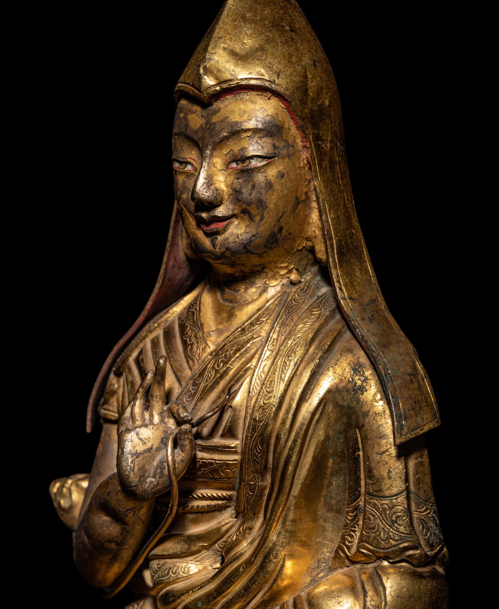 A Tibetan Gilt Bronze Repoussé Seated Figure of Tsongkhapa