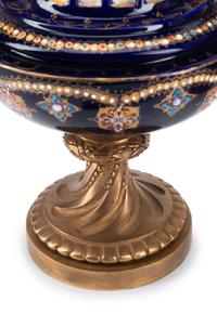 A Pair of Gilt Bronze Mounted Sèvres Style Porcelain Urns