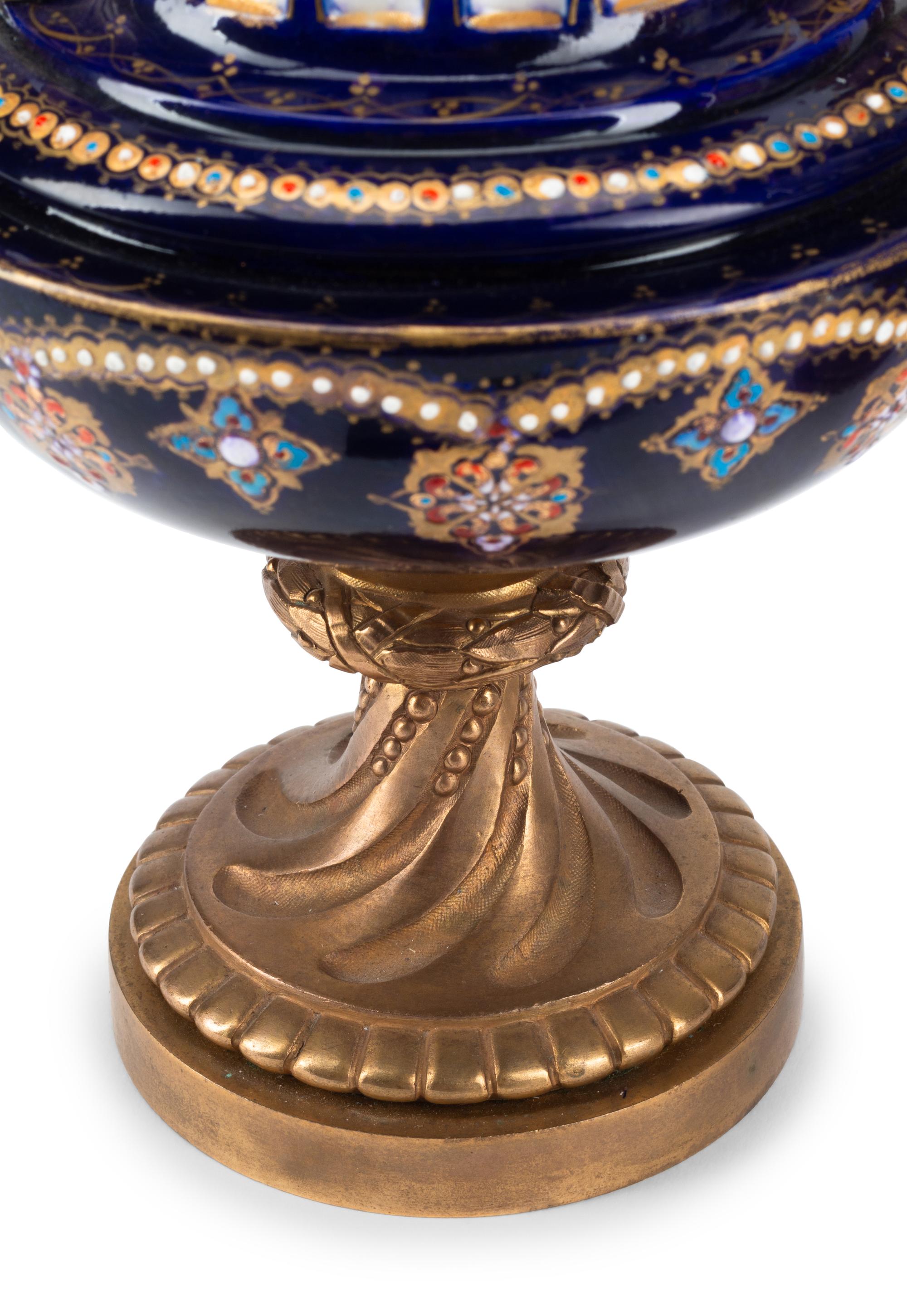 A Pair of Gilt Bronze Mounted Sèvres Style Porcelain Urns