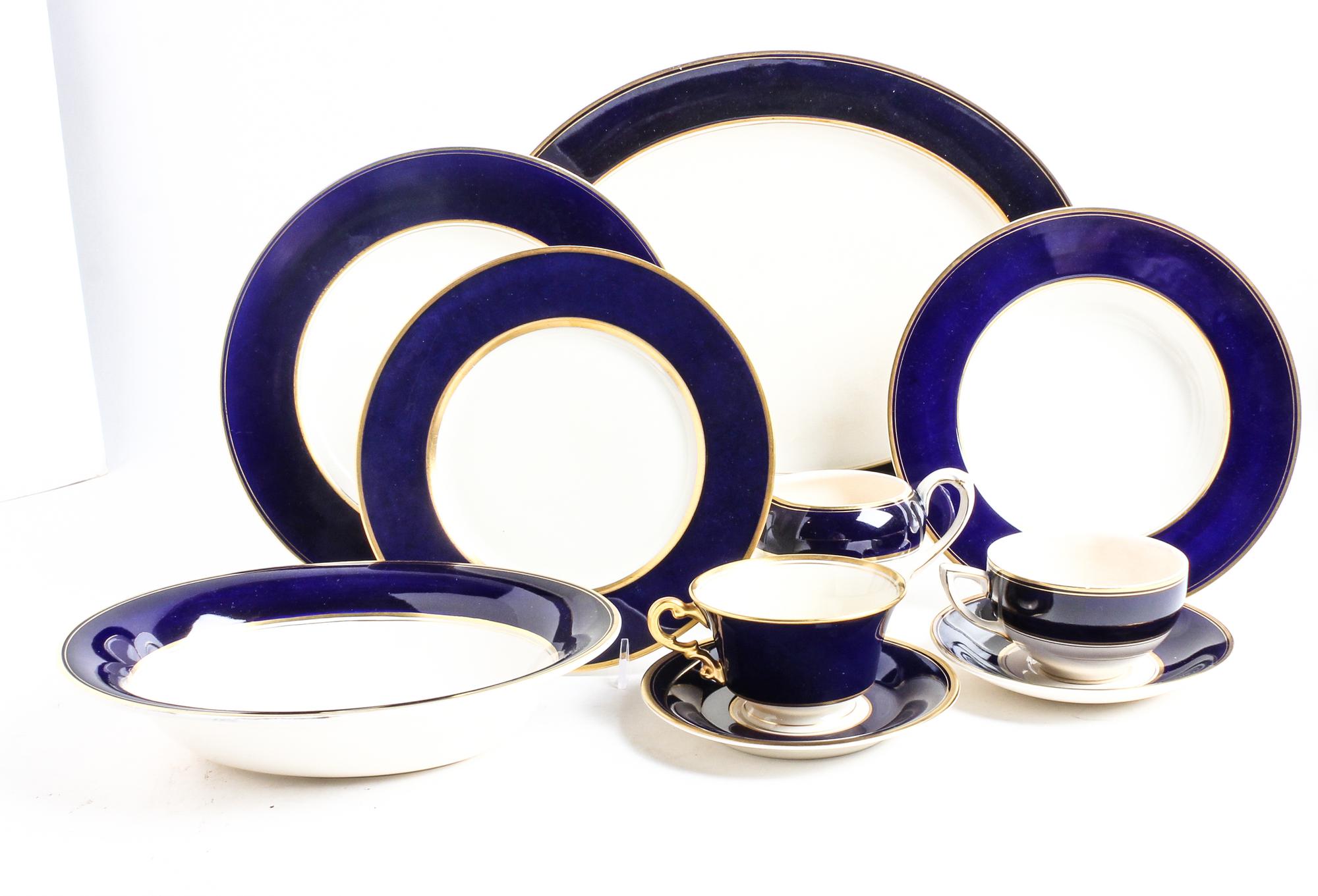 A Cobalt and Gilt Decorated Porcelain Dinner Service Diameter of dinner plate 10 1/4 inches. — 20TH CENTURY