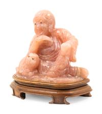 A Chinese Carved Rose Quartz Figure of a Luohan