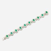 An emerald, diamond, and white gold bracelet