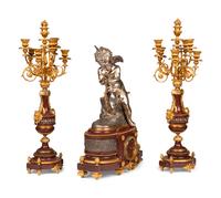 A French Gilt and Silvered Bronze and Rouge Marble Three-Piece Clock Garniture