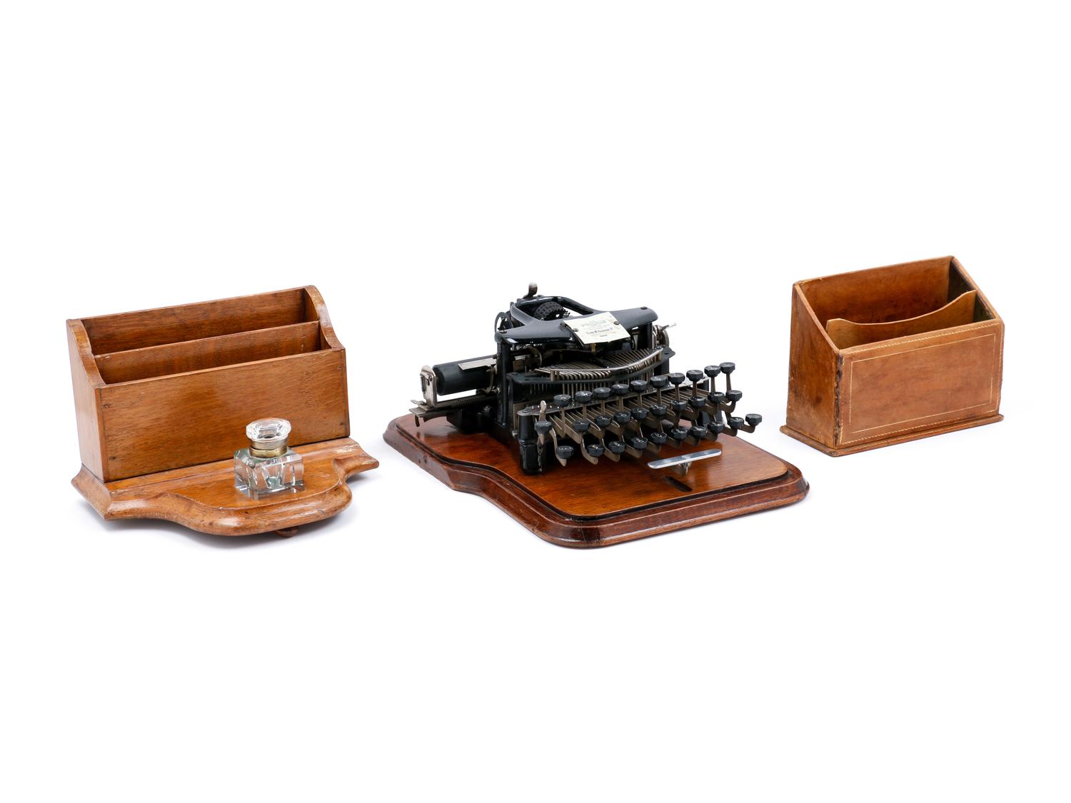 A Postal No. 5 Typewriter with a Wood Case