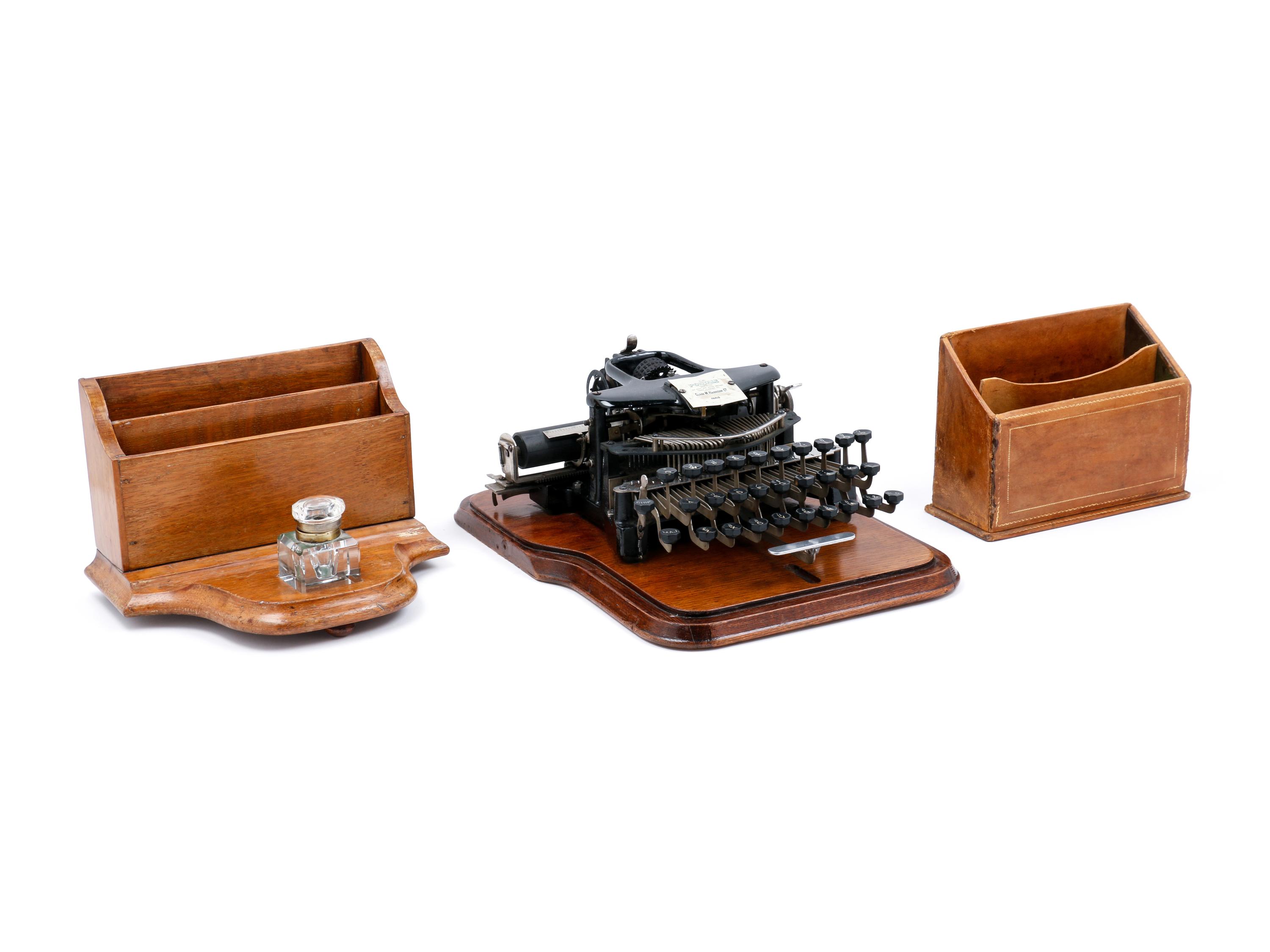 A Postal No. 5 Typewriter with a Wood Case
