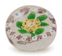 A Baccarat Spotted Yellow Wheatflower and Millefiori Garland Glass Paperweight