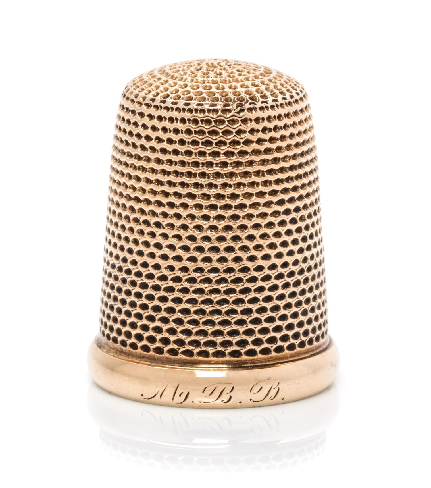 An American 14-Karat Yellow Gold Thimble, Carter, Gough & Co., Newark, NJ, the knurled top and body above a plain rim with an engraved