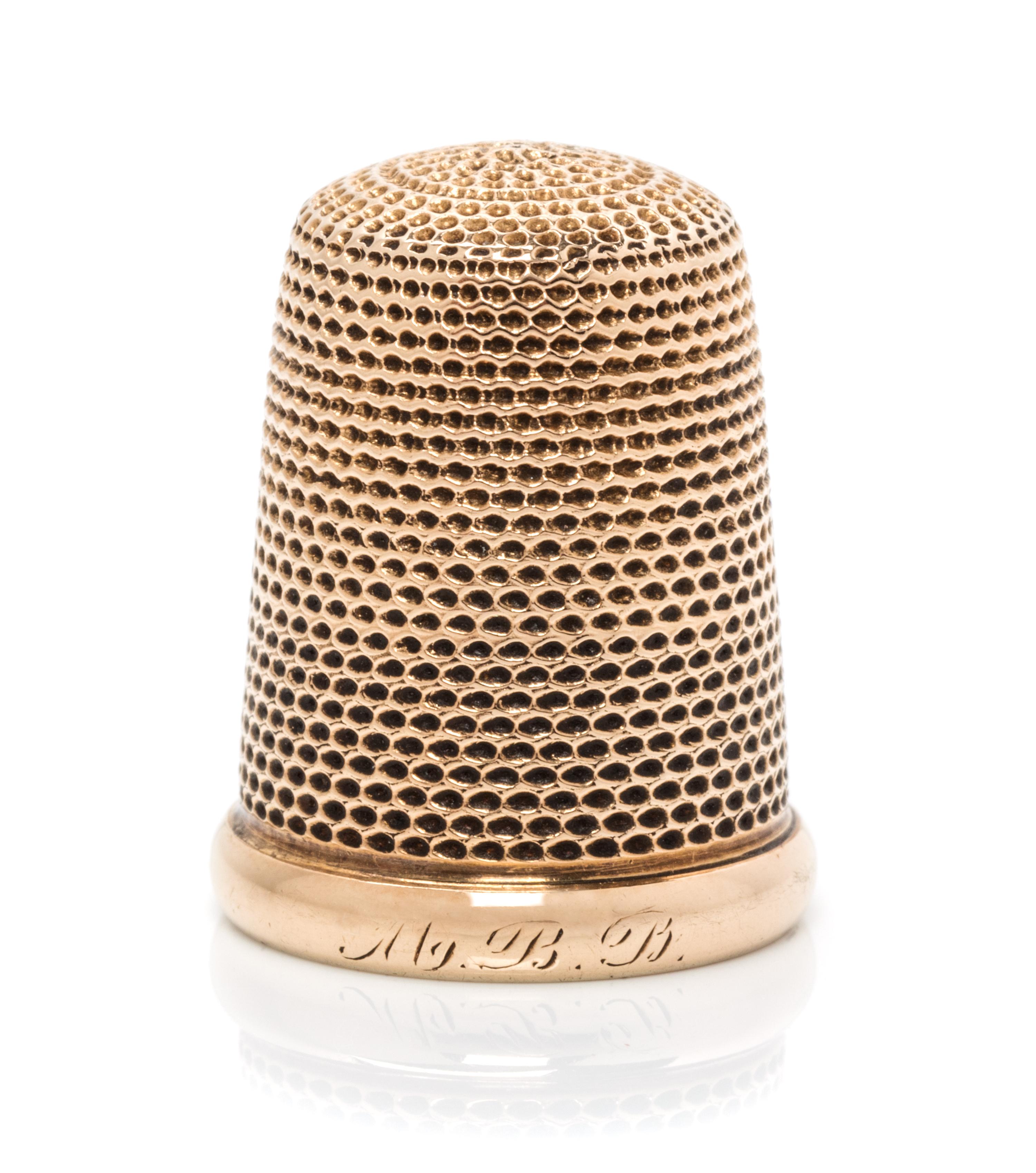 An American 14-Karat Yellow Gold Thimble, Carter, Gough & Co., Newark, NJ, the knurled top and body above a plain rim with an engraved