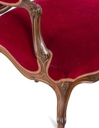 An Italian Louis XV Style Carved and Parcel Gilt Walnut Parlor Suite