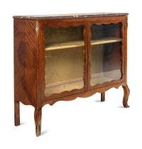 A Louis XV Style Gilt Bronze Mounted Bookmatched Mahogany Marble-Top Bookcase