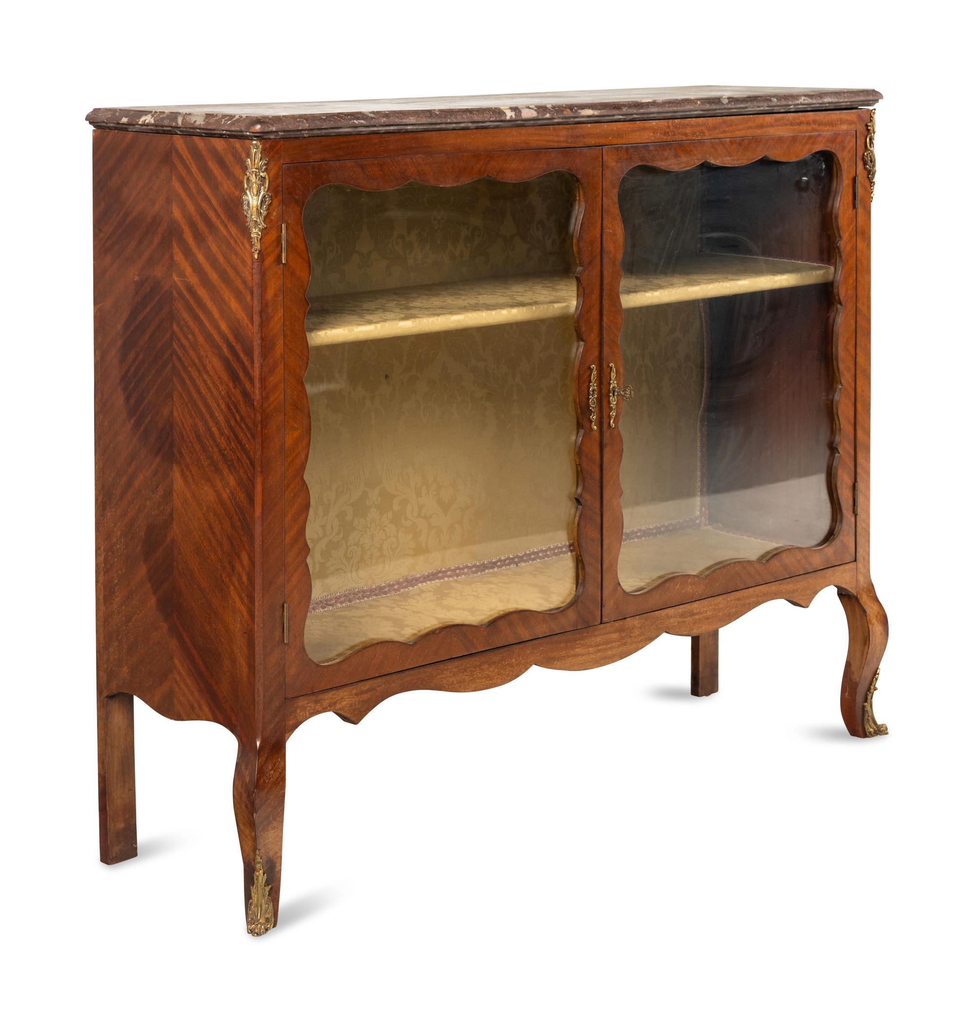 A Louis XV Style Gilt Bronze Mounted Bookmatched Mahogany Marble-Top Bookcase