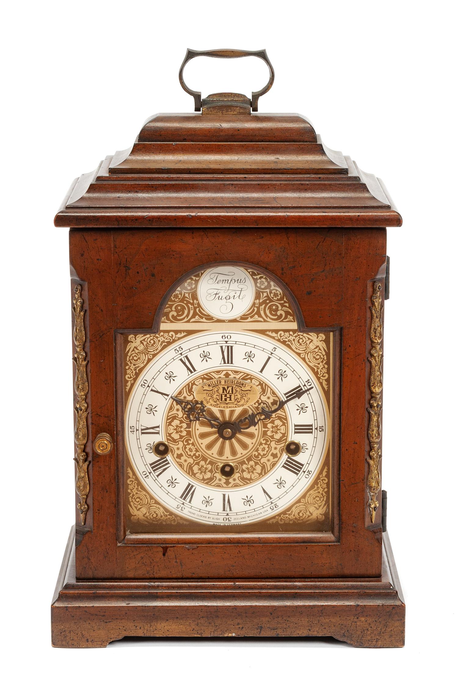 An English Mahogany Table Clock Height 16 1/2 x width 10 x depth 6 1/2 inches. — 19TH CENTURY