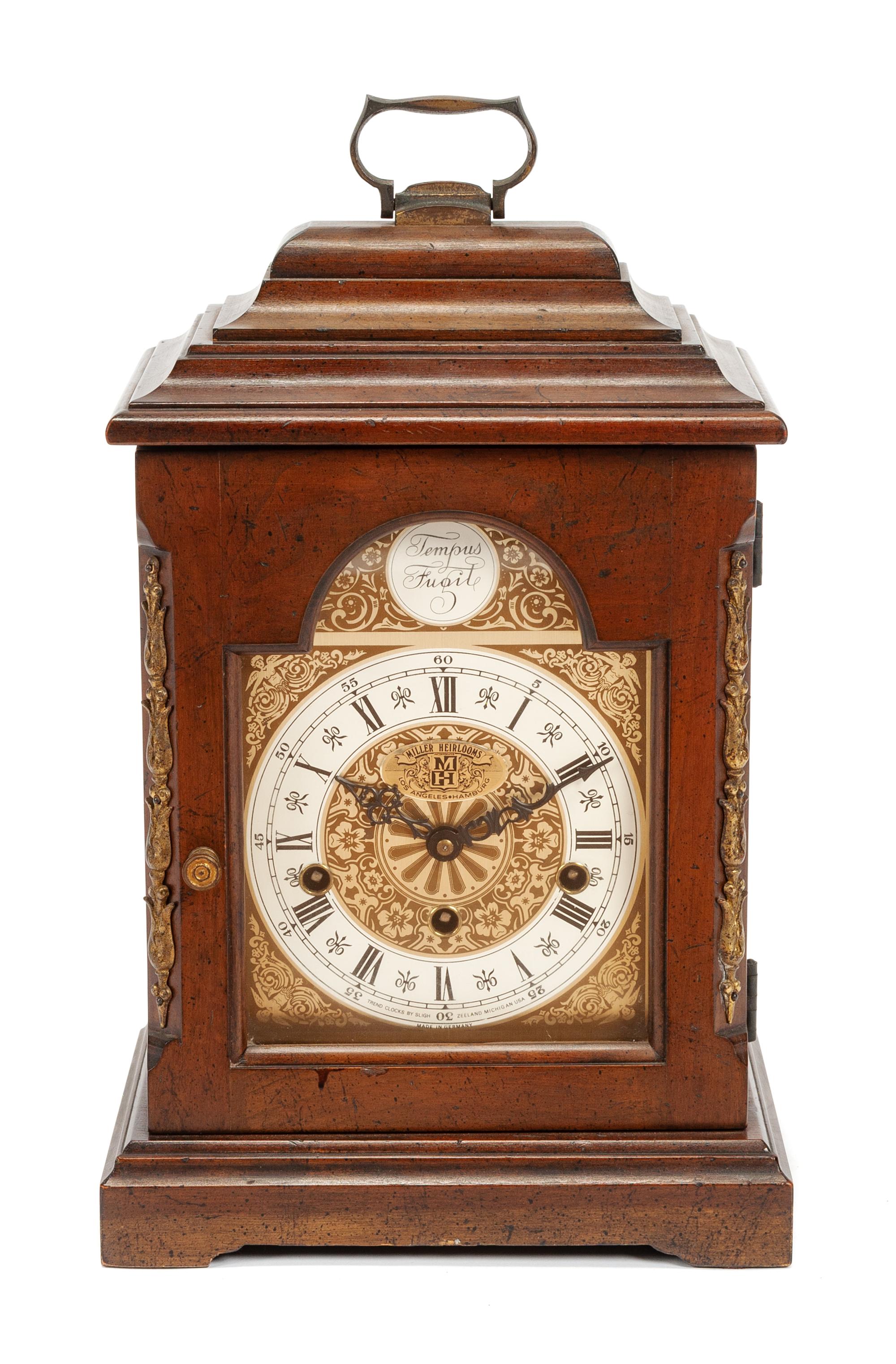 An English Mahogany Table Clock Height 16 1/2 x width 10 x depth 6 1/2 inches. — 19TH CENTURY
