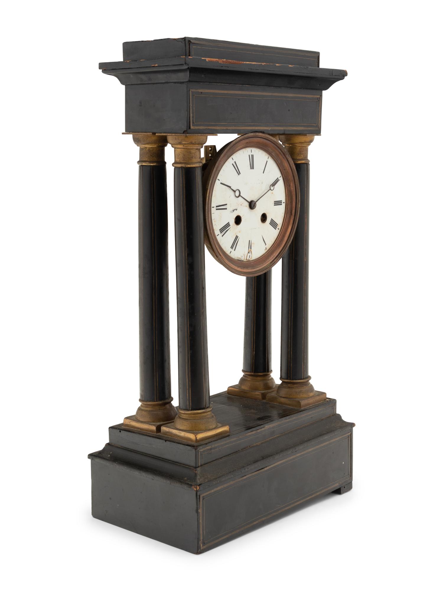 A Charles X Ebonized Mantel Clock