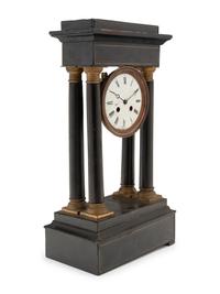 A Charles X Ebonized Mantel Clock